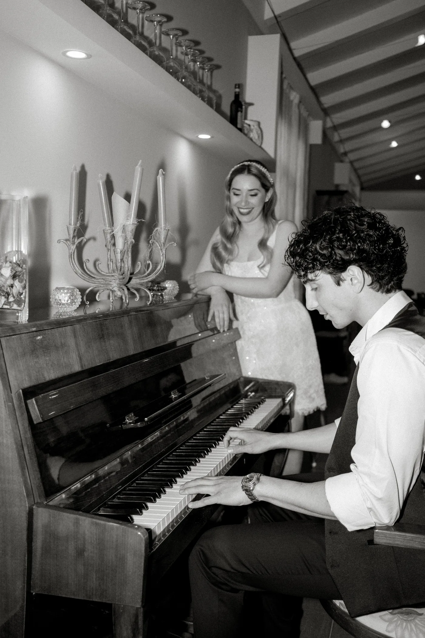 Couple with a musician at the piano, black and white
